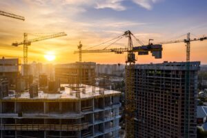 construction-site-with-cranes-at-sunset-construction-of-an-apartment-building.jpg